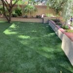 Synthetic turf installation in a backyard.